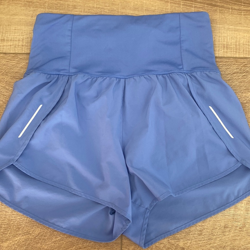 All in Motion running shorts, high waisted, size small. Powder blue